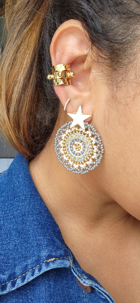 Ear gold cuff and beaded grey with a star gold earrings 