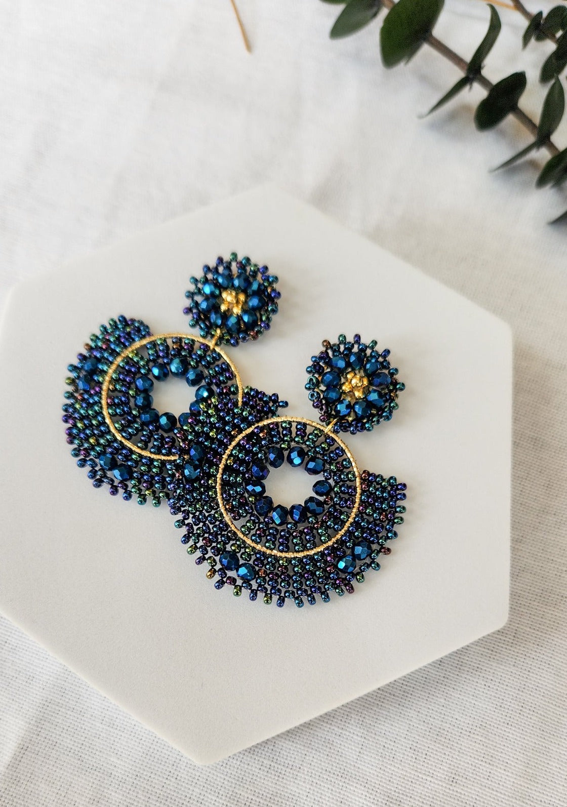 Deep blue indigo beaded earrings with gold details 