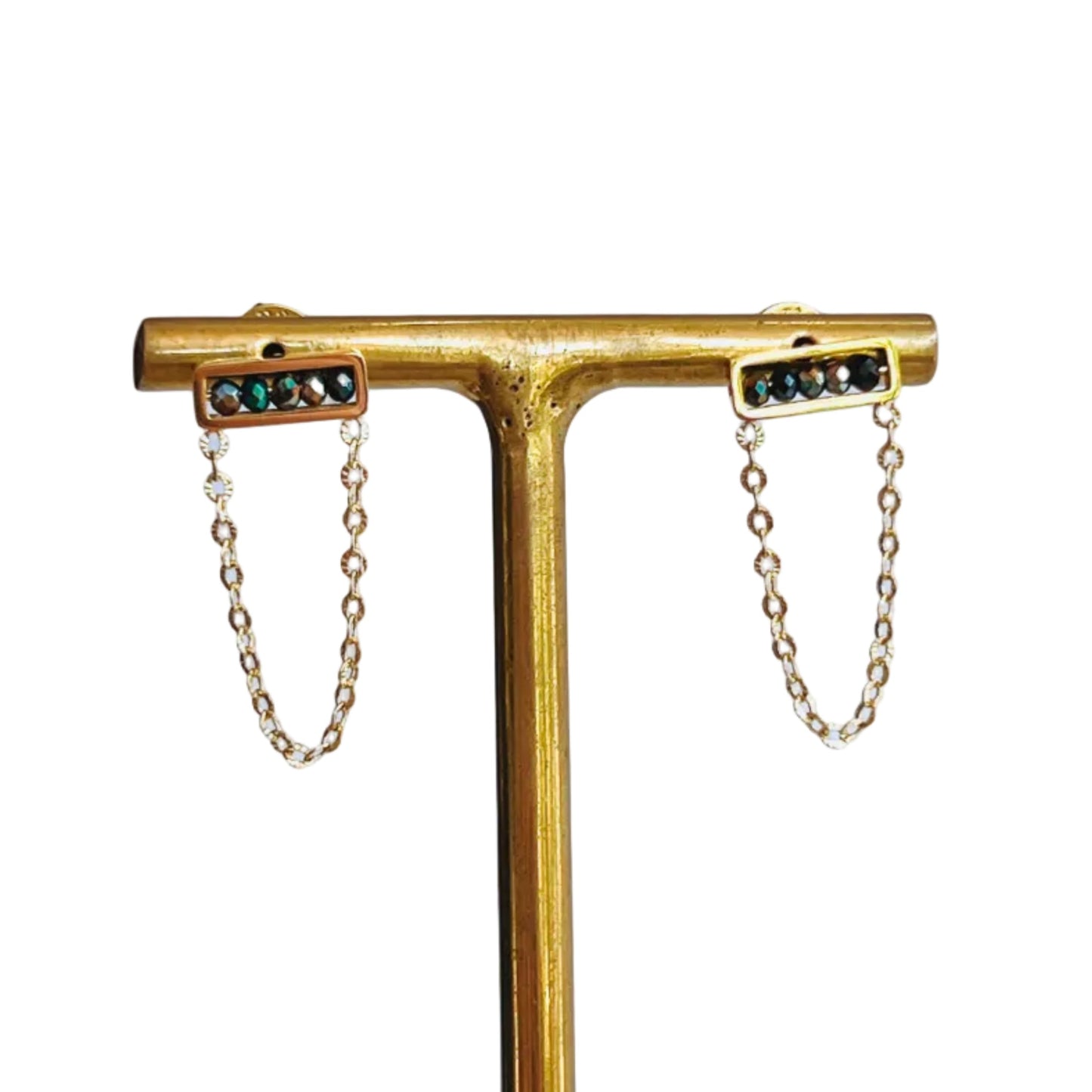 Abaco Chain Earrings - MidnightGold earring stand with two gold chain purple and black gemstone earrings on a light background