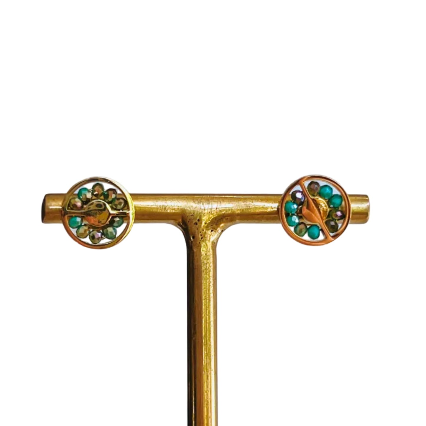 Abaco Stud Earrings - Aquamarine Gold earrings with green turquoise gemstones on an earrings stand on a light background