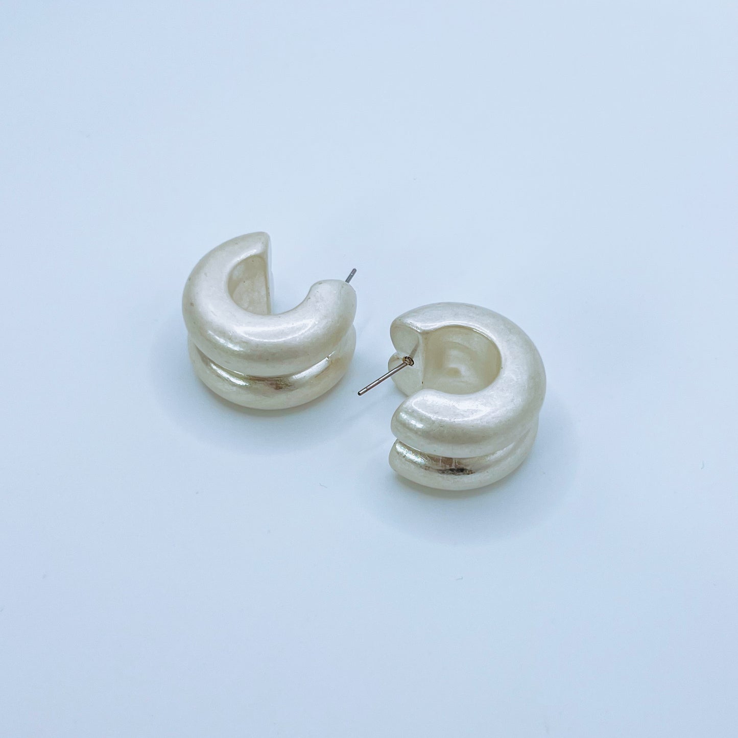 Chunky Silver Hoop Earrings Pair of silver hoop earrings on a background