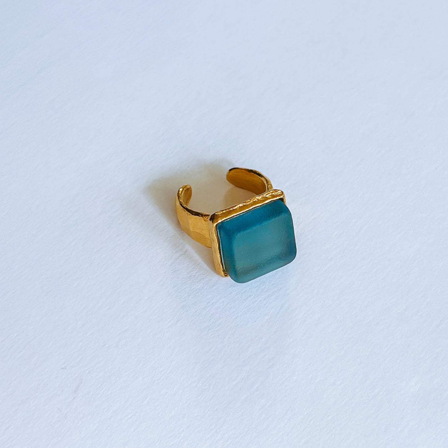 Cube Ring Gold - Periwinkle Gold plated ring with a square blue sea glass on a light background