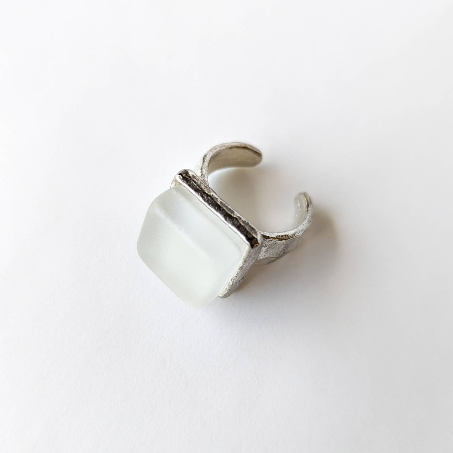 silver recycled glass cube statement ring with a square recycled glass stone on a white background