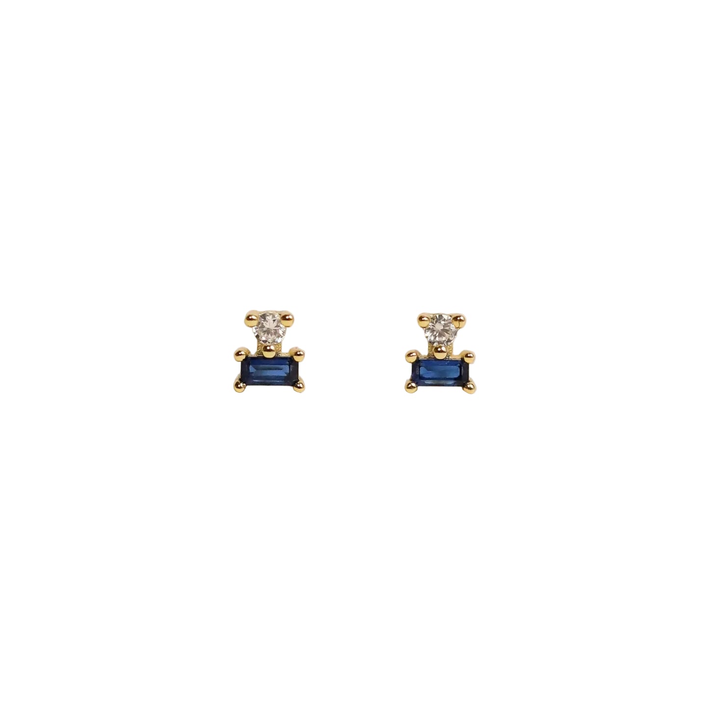 Double Gold Stud Stack - Sapphire Pair of gold earrings with blue gemstones on a background