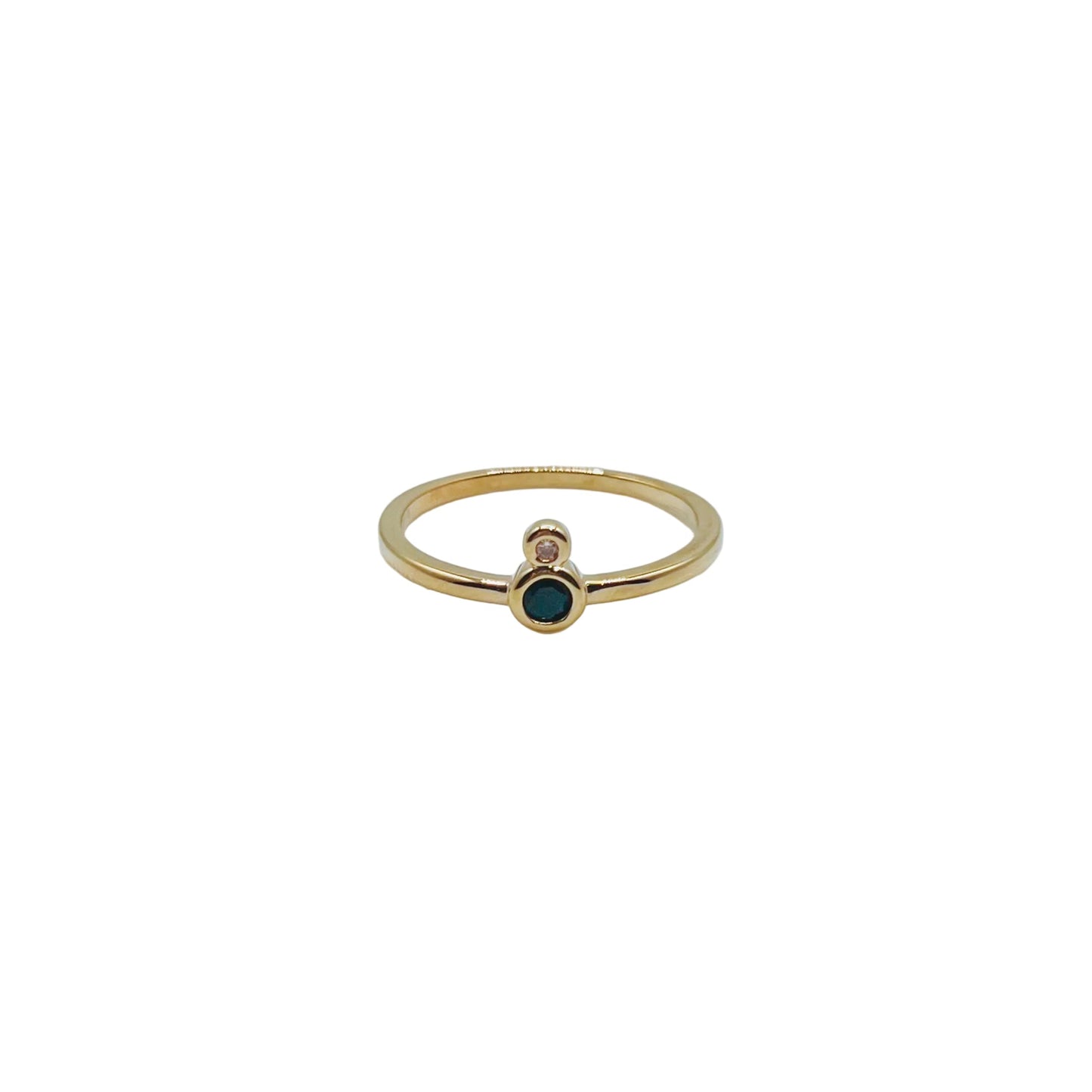 Gold Infinity Ring - Black Gold ring with a small black gemstone on a white background