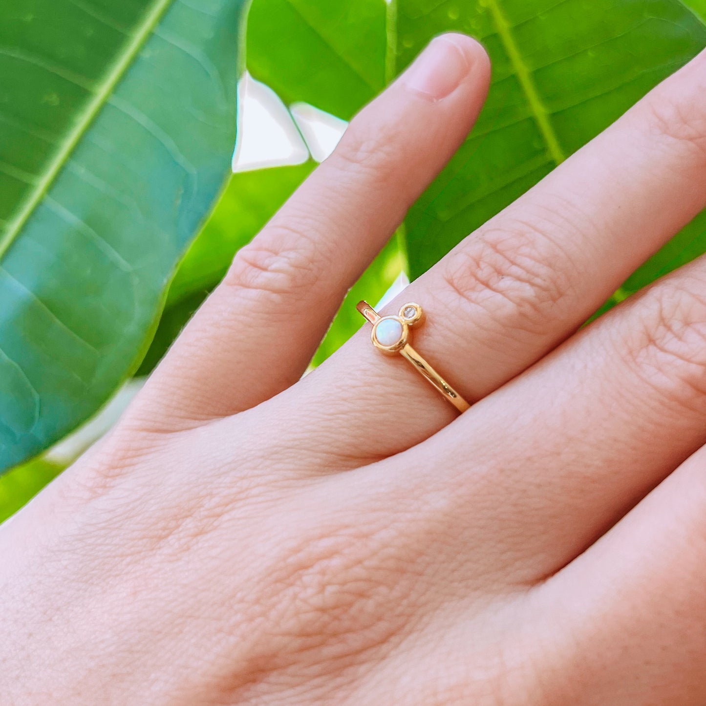 Gold Ring - Opal Gold ring with a small stone on a hand 