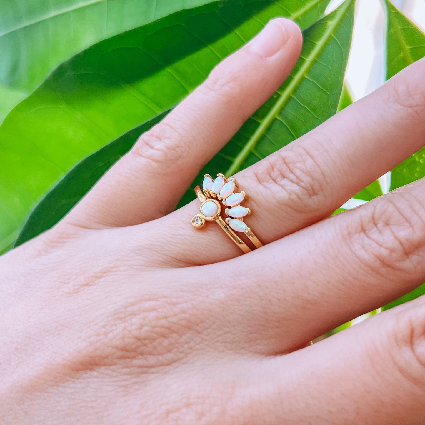 Gold Ring and crown ring - Opal stack two Gold rings, with crown and a small round gem design, on a hand 