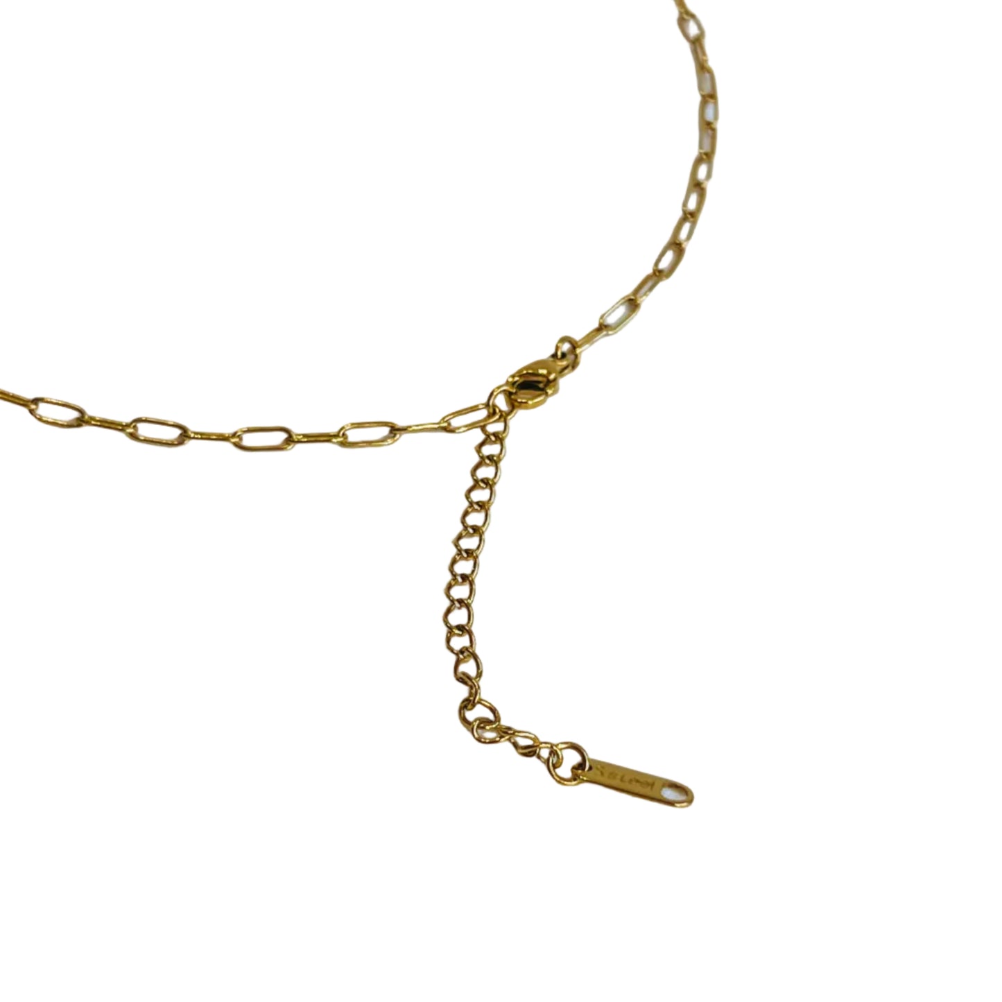 back of Gold Trio Necklace Gold chain necklace on a light background closeup clasp 