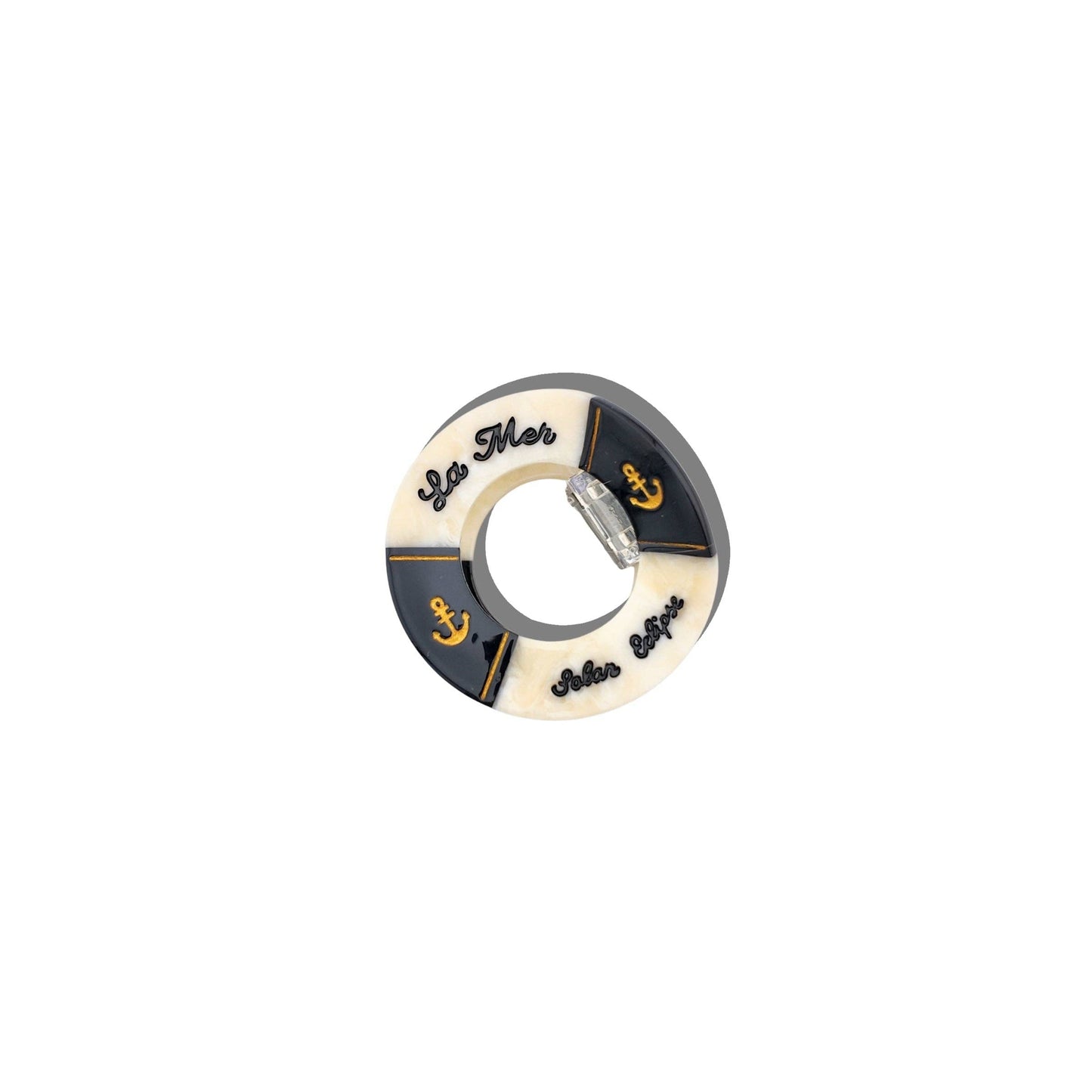 Hand- painted black and white life buoy claw hair clip with 'La Mar' branding on a white background. 
