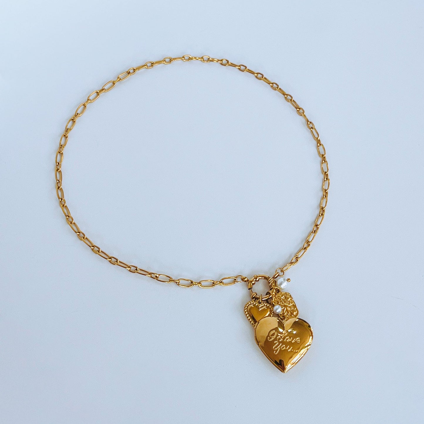 Heart Locket Necklace Gold necklace with a heart-shaped charm 