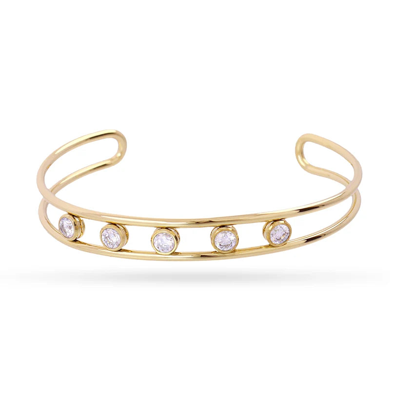 Multi Stone Cuff Gold bracelet with crystals on a white background