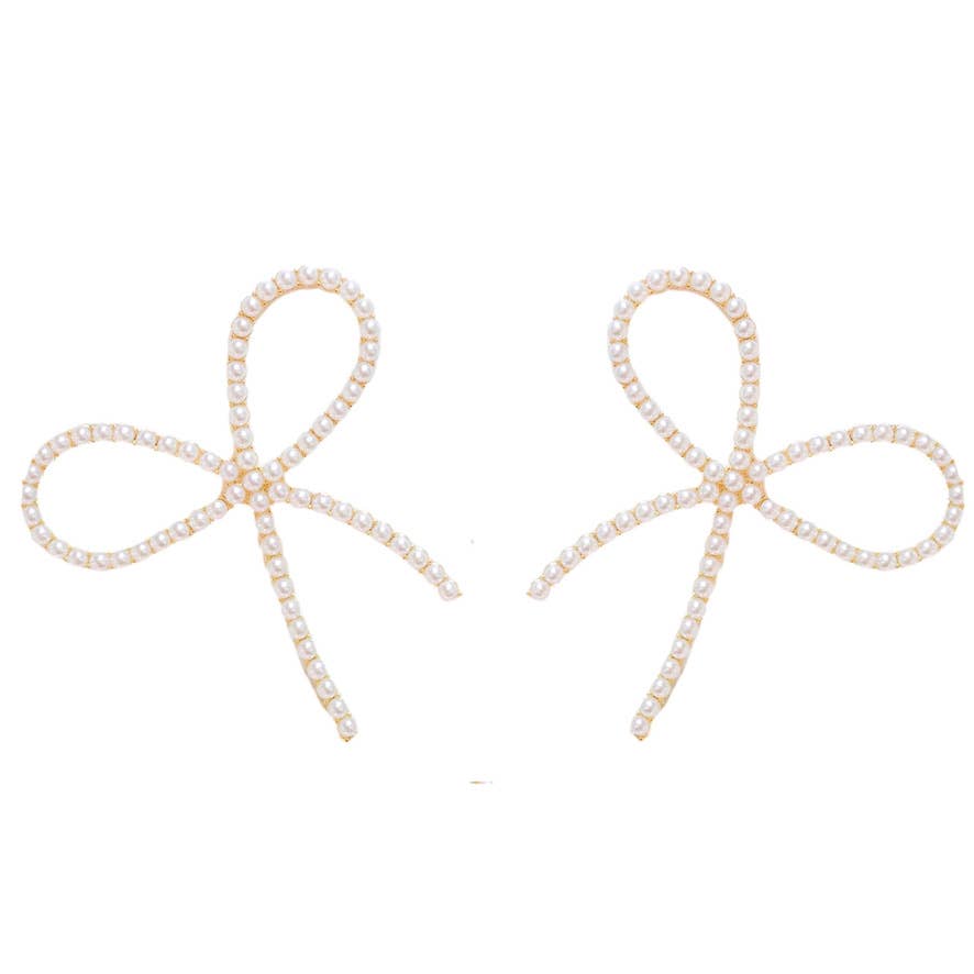 Pearl Statement Bow Earrings Pearl bow-shaped earrings on a white background