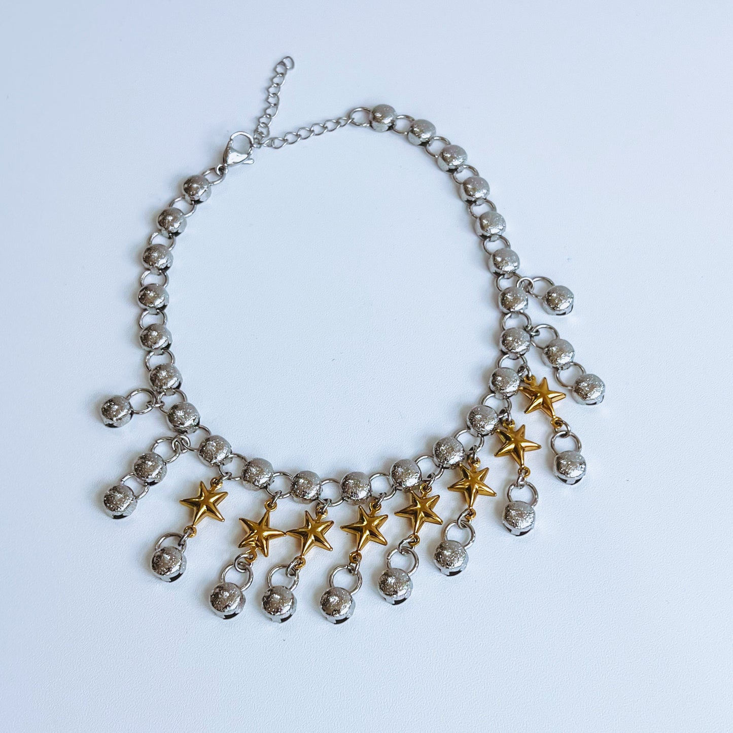 star choker Necklace with star-shaped pendants on a background