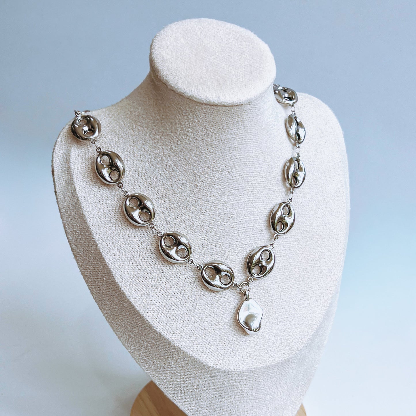 Theta Chunky Necklace - Silver chunky Silver necklace on a white mannequin bust on light background