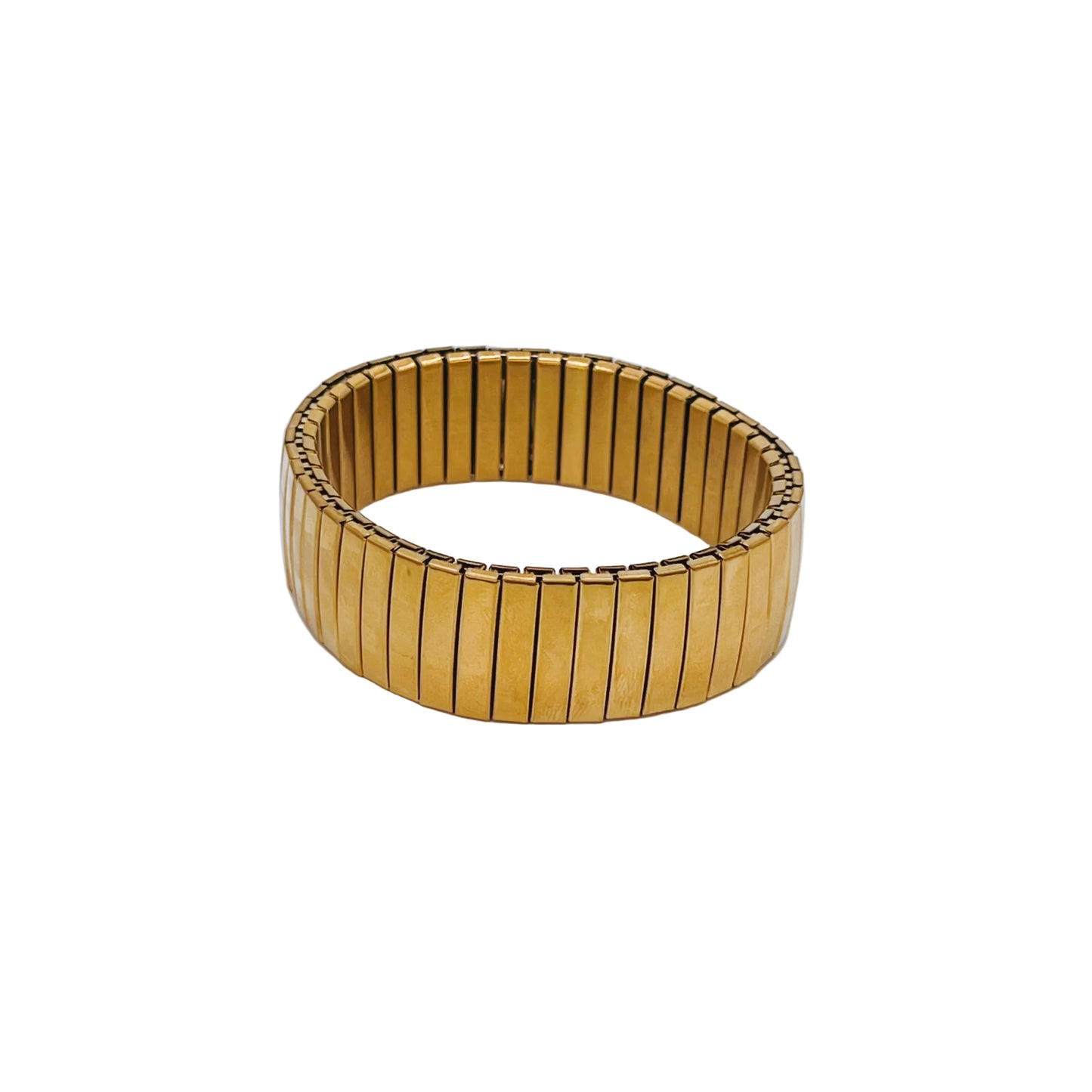 Thick Gold Elastic Bracelet on a light 
background