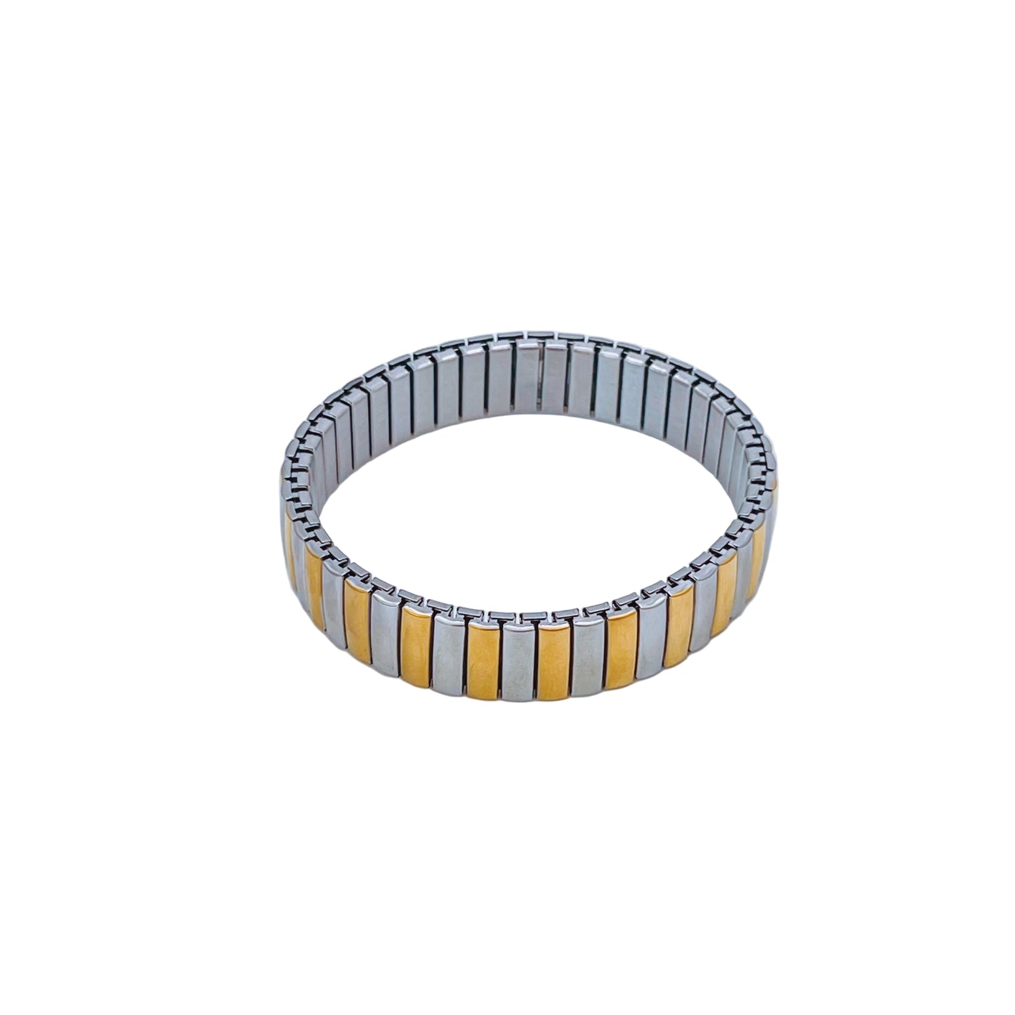 mixed metal elastic bracelet with alternating silver and gold bands on a light background