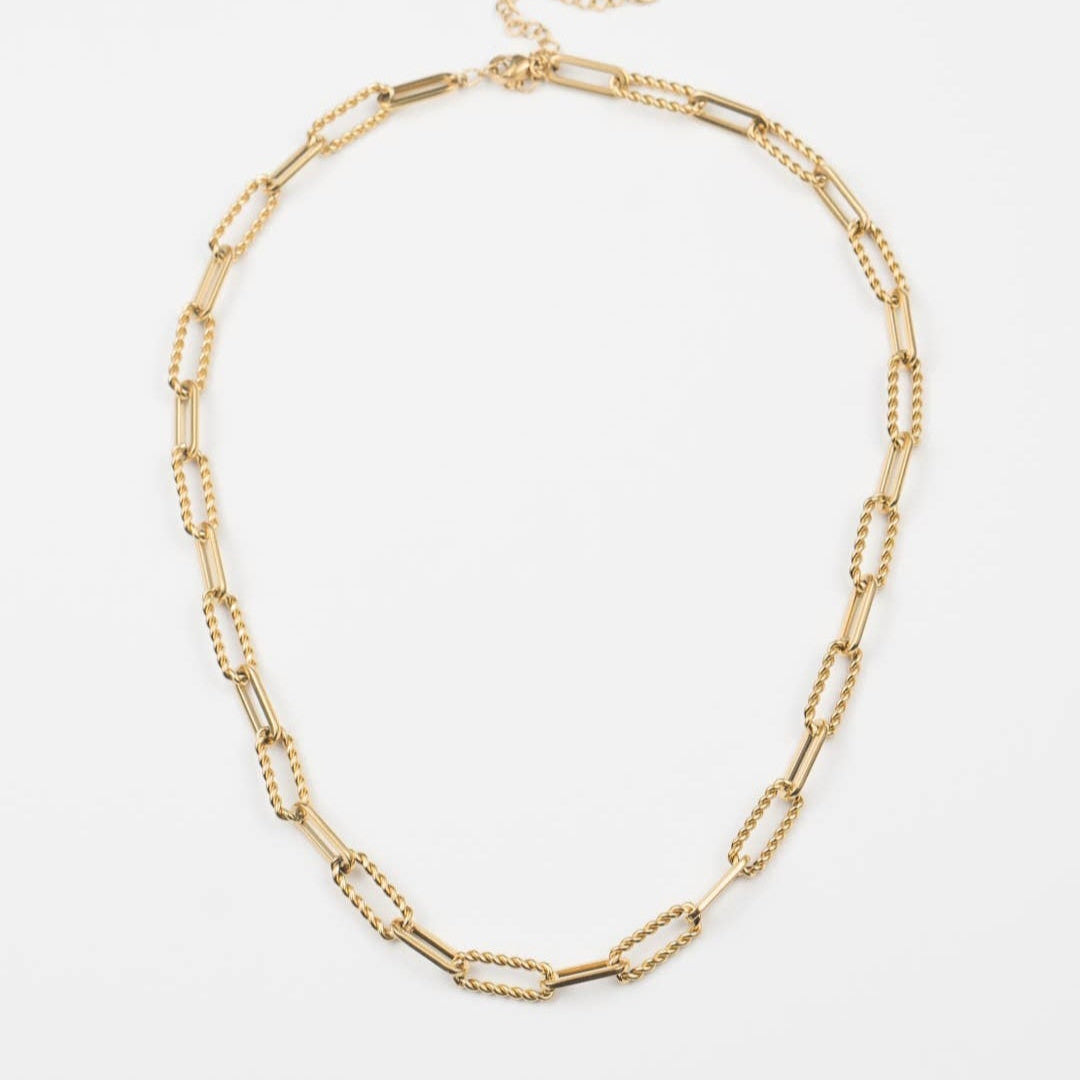 Gold chain necklace on a white background